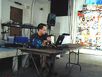 Local Greg Davis performs an electro-acoustic inspired set all from a convenient powerbook.